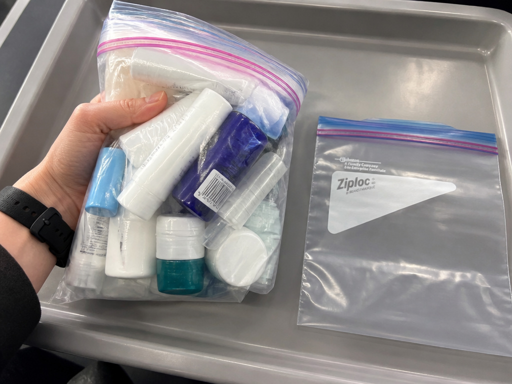 Overstuffed sandwich bag versus compliant quart bag for TSA 3-1-1 rule.