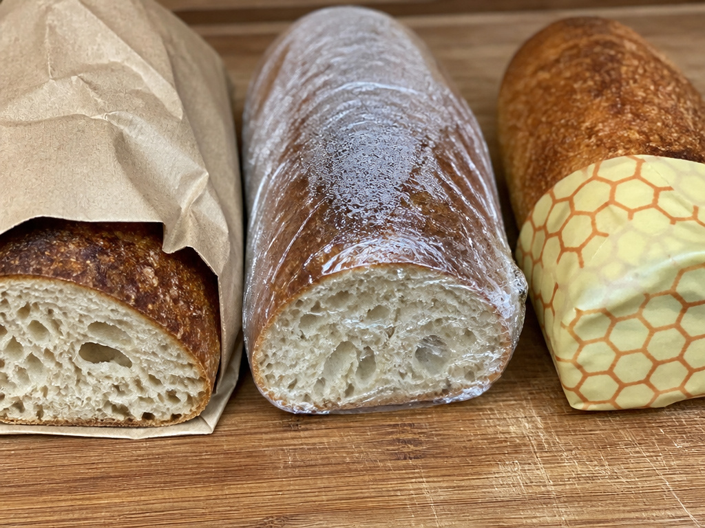 Three methods to store a cut sourdough loaf: paper bag, plastic bag, and beeswax wrap.